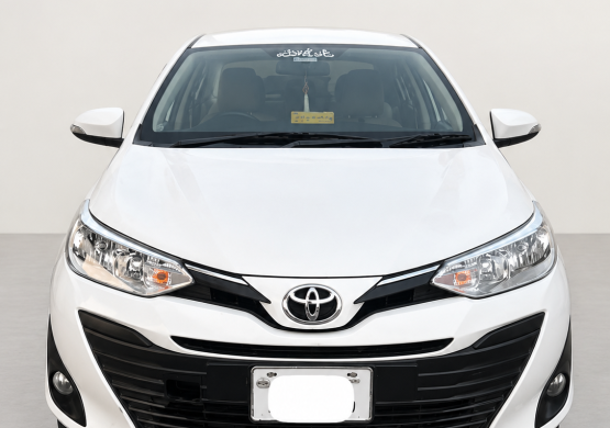 Front-Facing White Toyota Sedan (1)