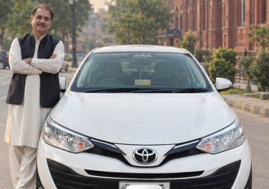 Toyota and Traditional Attire by Historic Brickwork