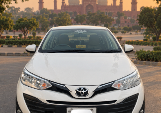 White Toyota Sedan at Sunset Mosque
