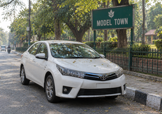 White Toyota at Model Town Park